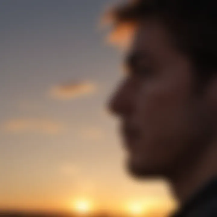 Silhouette of a person looking towards the sunrise