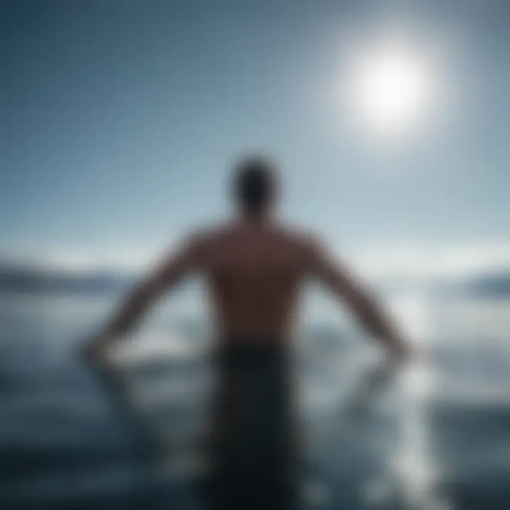 An invigorating view of a person diving into clear, icy waters under a bright sky.