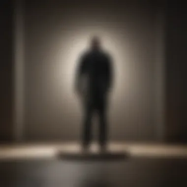 The Weight of Isolation A shadowy figure standing alone, illustrating feelings of isolation