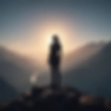 Silhouette of a person standing strong on top of a mountain